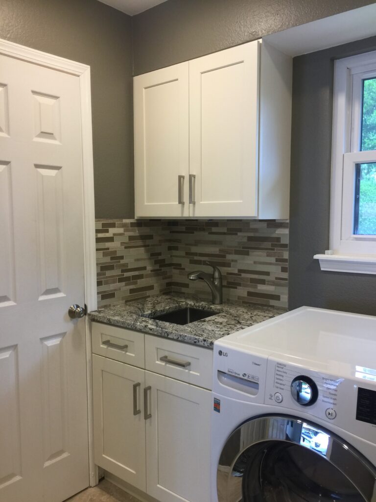 Laundry room cabinets painted and refreshed