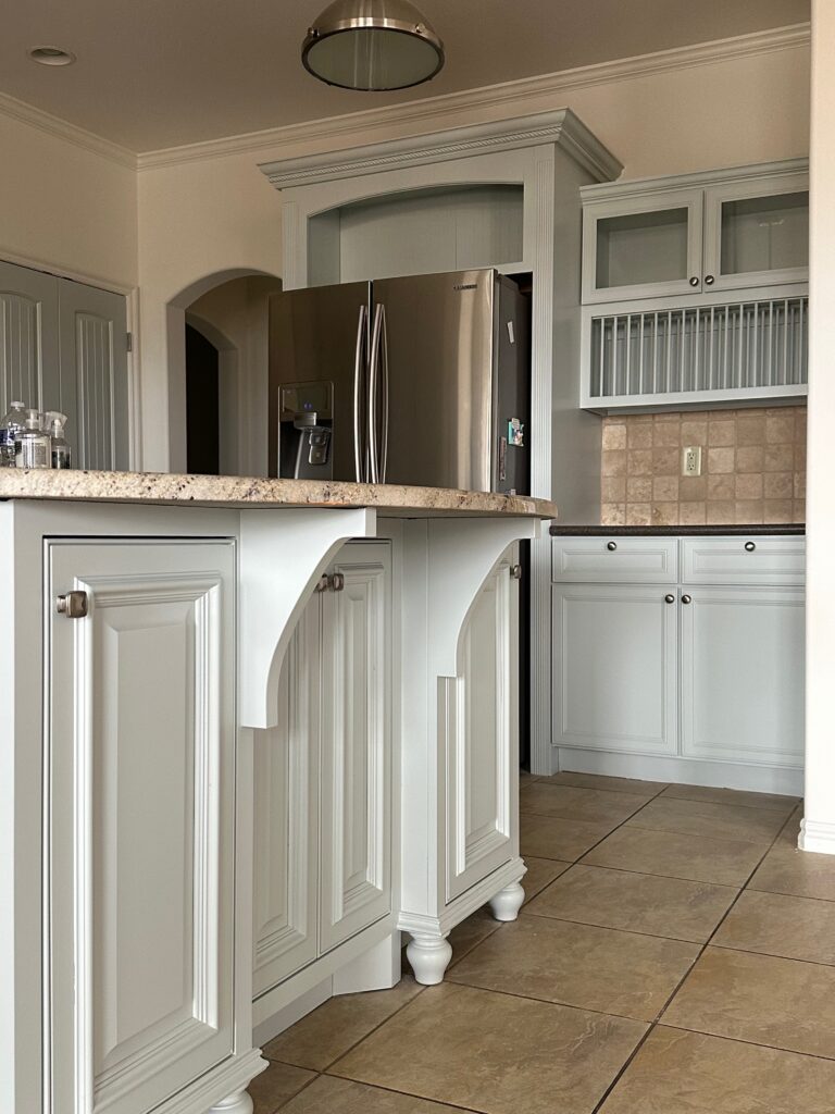 Kitchen island cabinets refinished in soft green