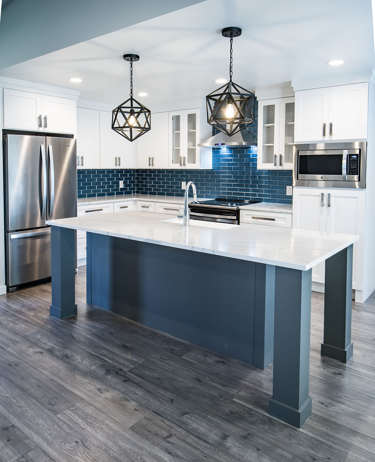 White and blue kitchen cabinet painting and refinishing in Tulsa by Zest Painting